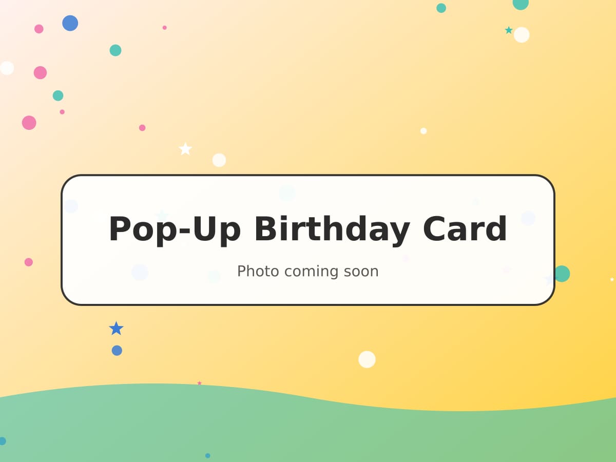 An open greetings card with a colourful three-tier pop-up birthday cake inside