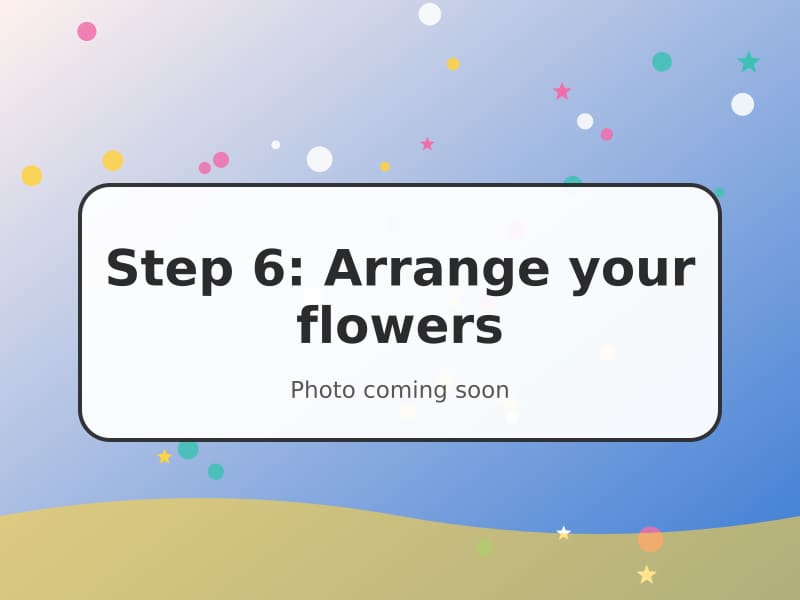 Finished quilled flowers on a card with leaves and stems
